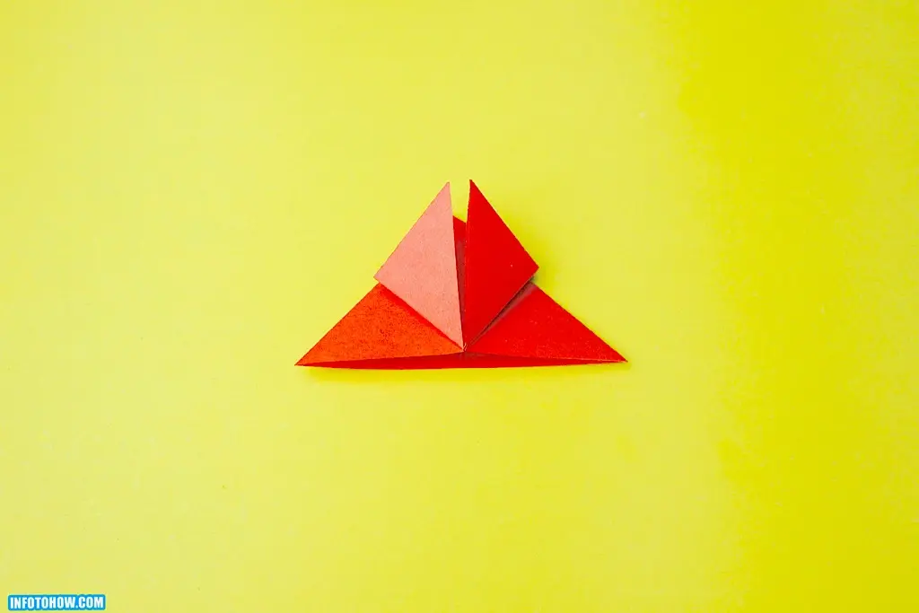 Fold one side of the triangular shape